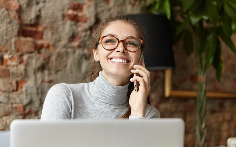 happy-student-girl-enjoying-modern-gadgets-talkine